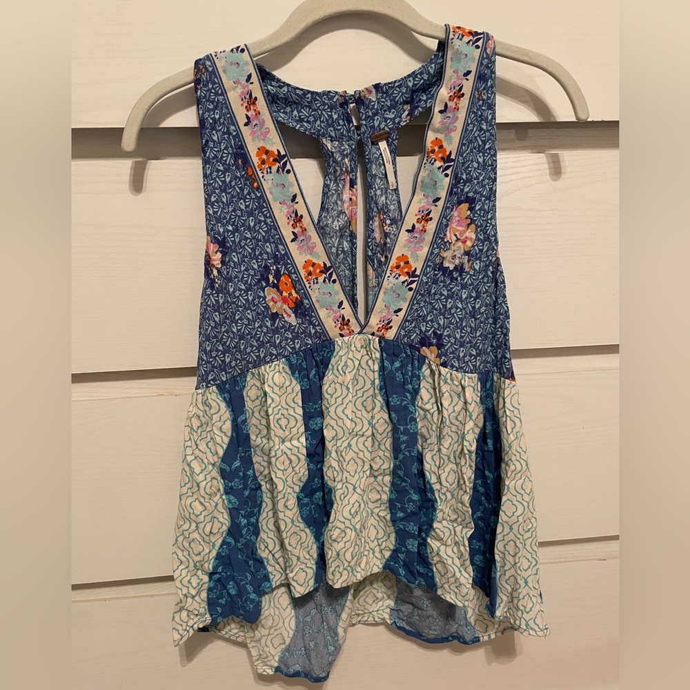 Free People, this “Dream Darlin’ Tank Top” has a multi-colored floral pattern